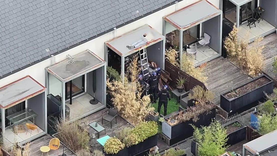 Rooftop Standoff: Riot Cops Wake Sleeping Suspect Who Threw Tiles at Officers