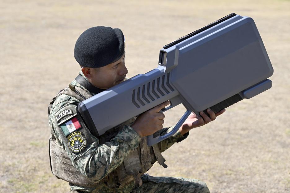 A member of the Mexican Army’s special anti-drone battalion gives a demonstration for the press.