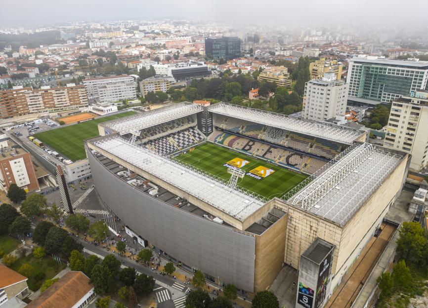 Aerial view of Estádio do Bessa stadium surrounded by city buildings.