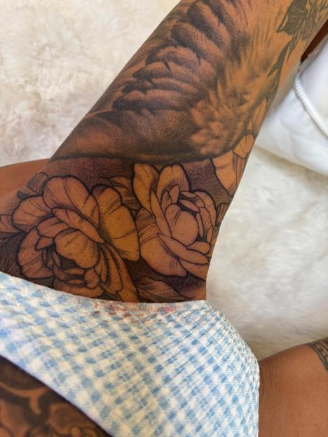 Katie Price's new large floral tattoo on her thigh.