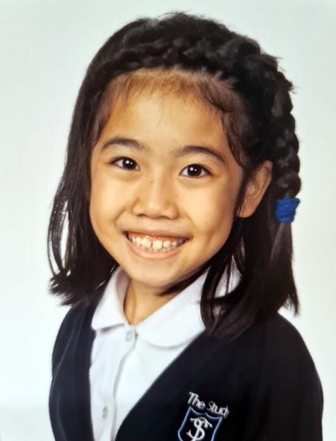 Eight-year-old Selena Lau, a victim of dangerous driving, smiles.