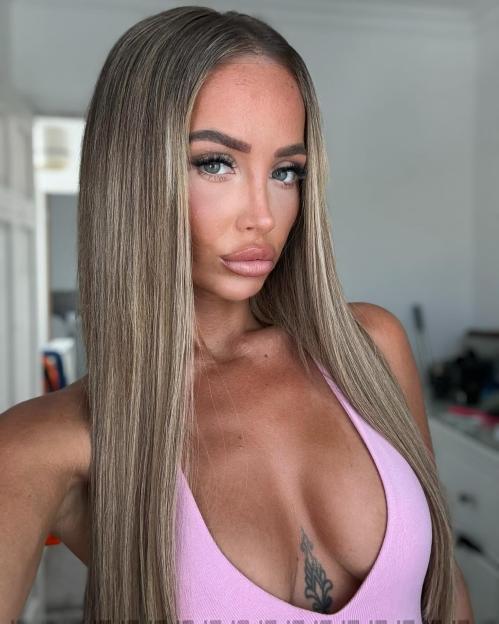 Former Love Island contestant Nicole Samuel in a pink top.