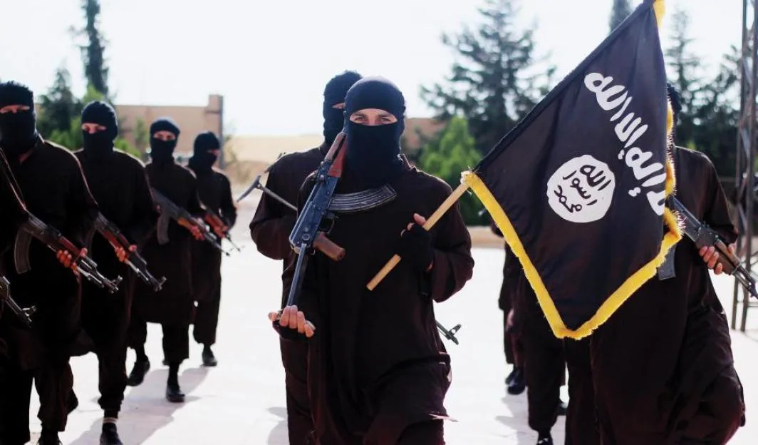 Islamic State of Iraq and the Levant propaganda photo showing masked militants holding the ISIS black banner of Muhammad.