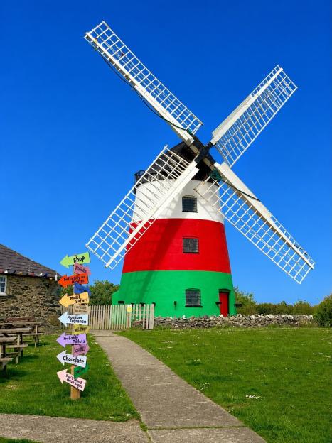 Windmill row erupts as owner ordered to repaint it after colourful makeover