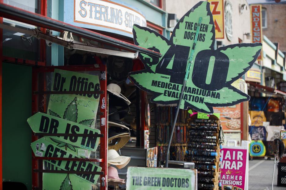 Signage advertising "The Green Doctors $40 Medical Marijuana Evaluations" in Venice Beach, California.