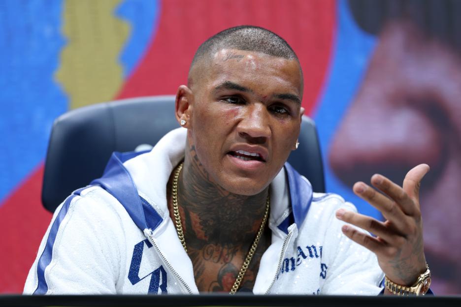 Conor Benn speaks during a press conference.