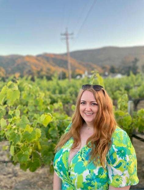 School teacher Moyra Whelan smiling in a vineyard.