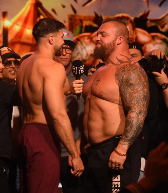 Tommy Fury and Eddie Hall face off at a press conference.