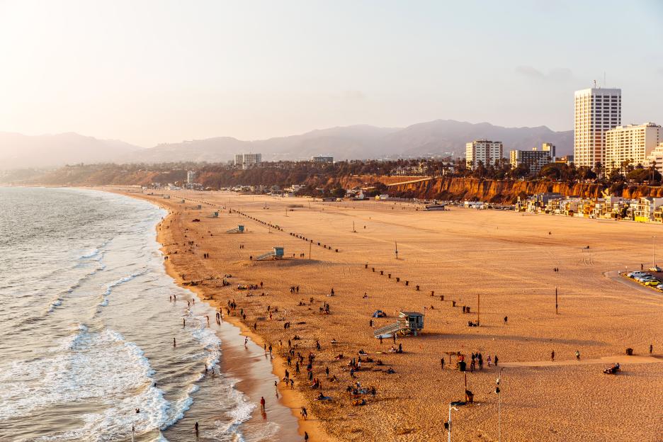 Santa Monica Beach and Los Angeles skyline at sunset, aerial view, California, USA