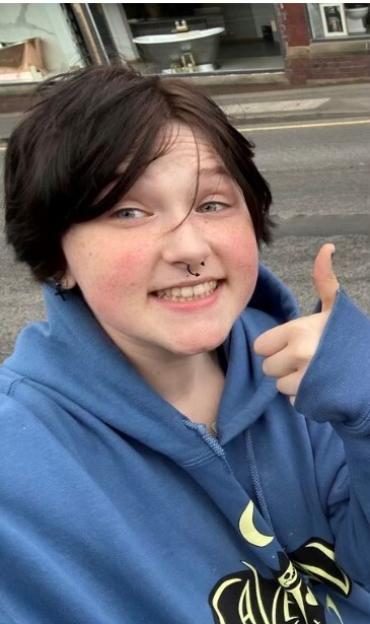 Finn Hall smiling and giving a thumbs up.