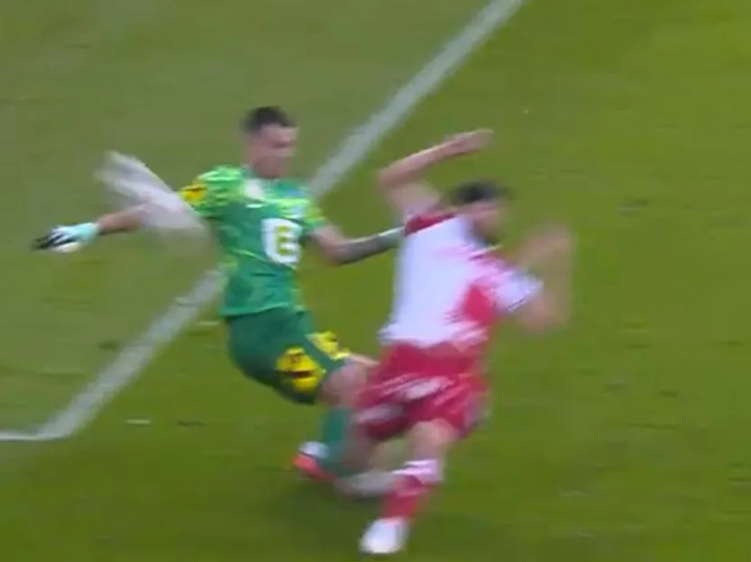 Goalkeeper suffers horrific injury during European derby with foot left pointing wrong way as players plead for help