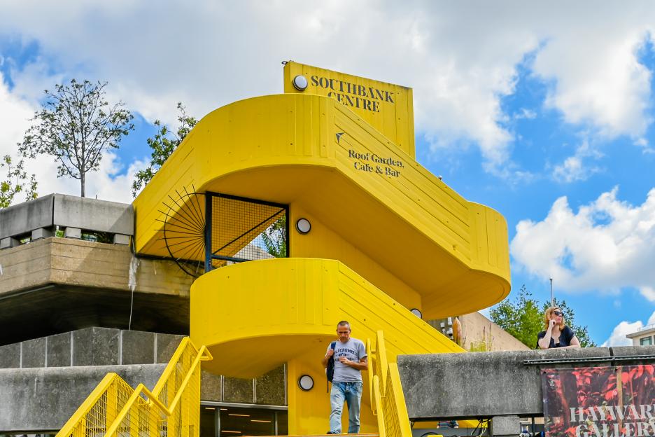 Exterior of the bright yellow Southbank Centre on the Southbank of the River Thames.