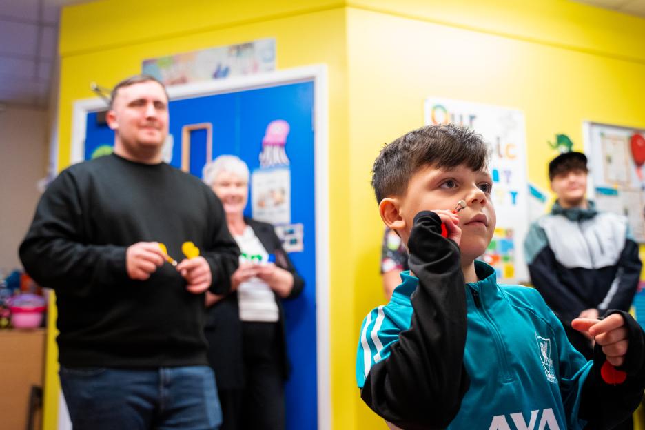 Luke Littler visiting a hospital.