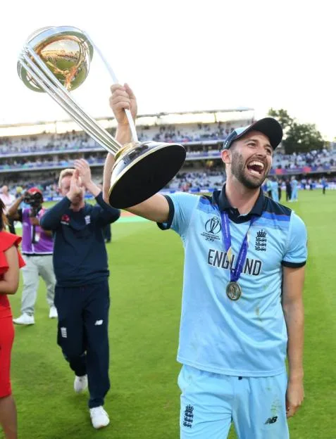 Mark Wood of England celebrates with the ICC Cricket World Cup 2019 trophy.