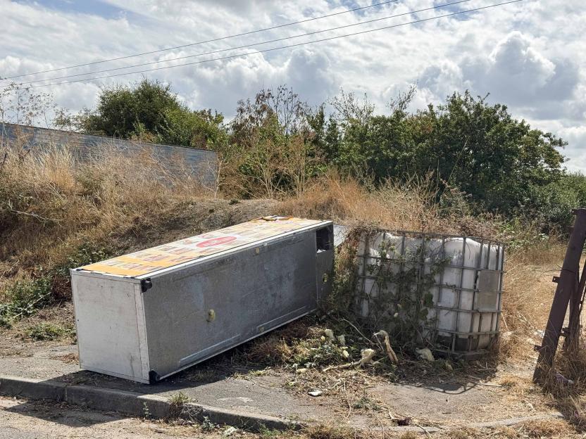 A South Ockendon travellers' site with an overturned trailer and water tank.