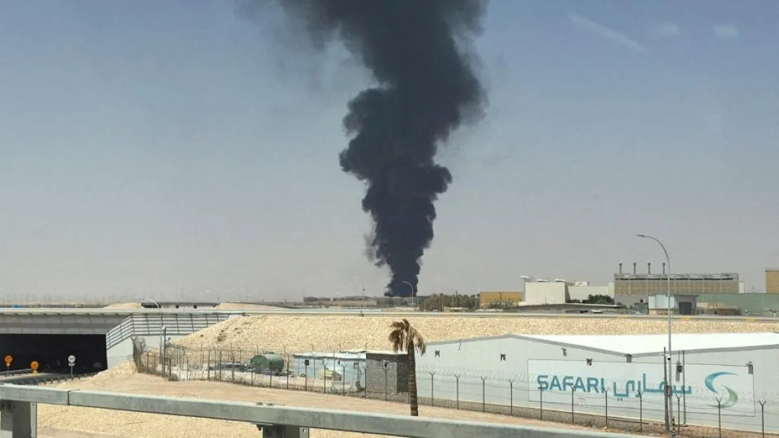 A large plume of black smoke rises from the fuel storage area at King Khalid International Airport, in Riyadh
