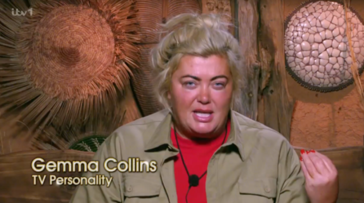 Gemma Collins speaking while wearing a red shirt and khaki jacket, with text "Gemma Collins TV Personality" at the bottom of the screen.