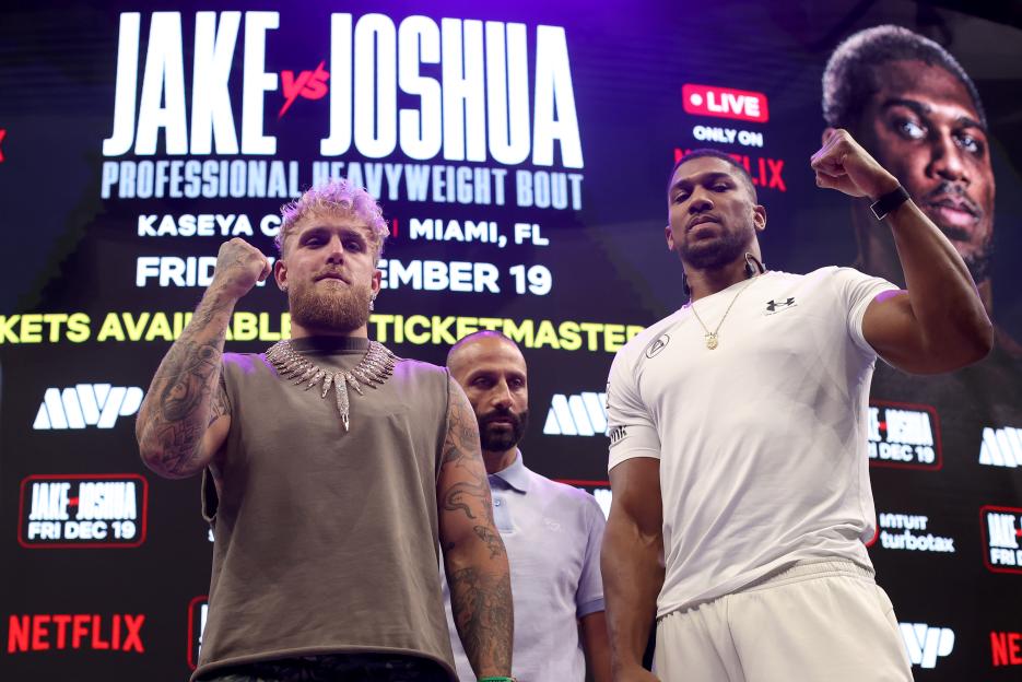 Jake Paul and Anthony Joshua face off during a press conference for their exhibition match.