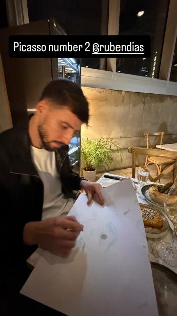 Ruben Dias drawing a picture during a Valentines meal.