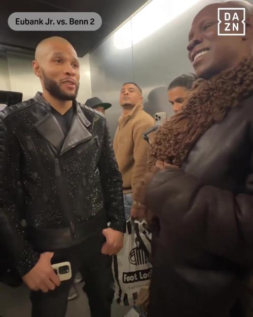 Chris Eubank Jr. and Sr. smiling in an elevator.
