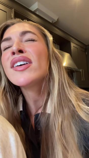 Zara McDermott singing.