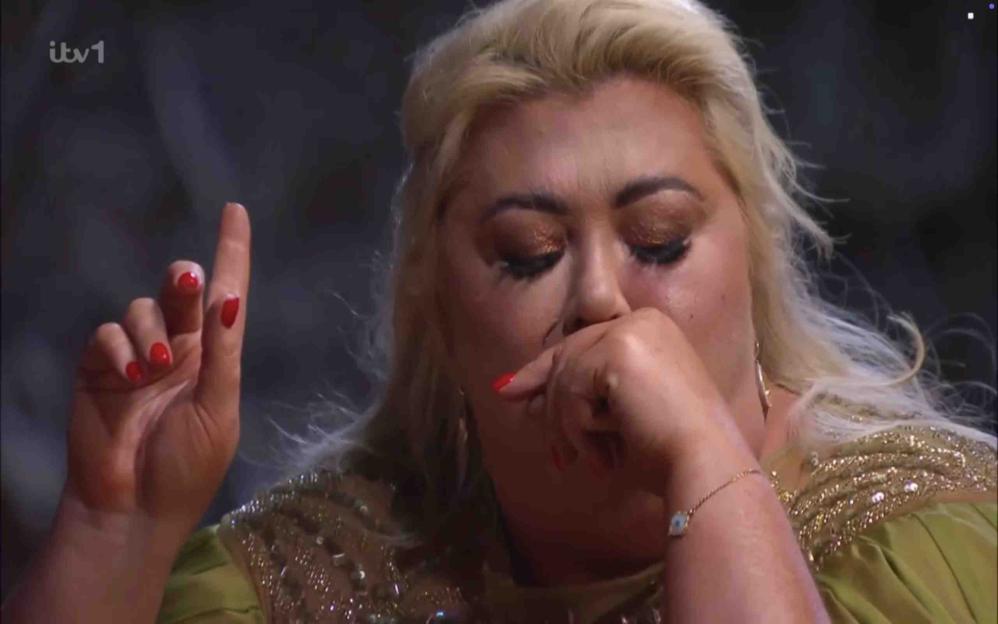 Gemma Collins crying with her hand to her mouth during an eating trial.