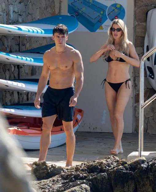 Ellie Goulding and boyfriend Beau Minniear walking near a pool and paddleboards at the Hotel du Cap-Eden-Roc in the South of France.