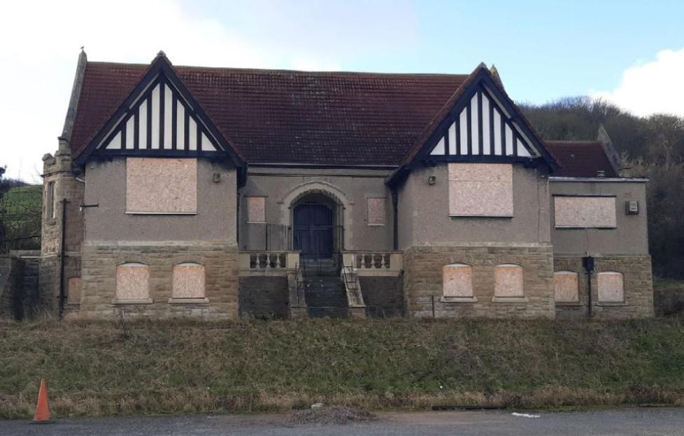 The Gronant Institute village hall with boarded-up windows.