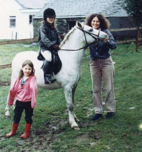 Megan Russell with Josie on a pony, and another young girl.