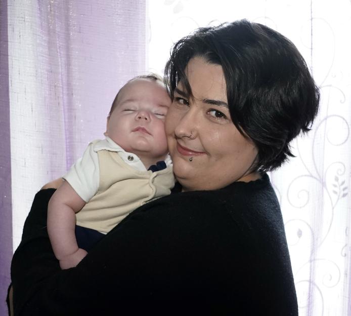 Alaina Goode holding her baby Robin.
