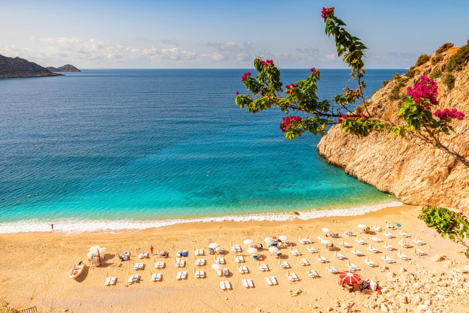 Kaputas beach in Antalya region, Turkey with clear turquoise water, sun umbrellas and sandy beach
