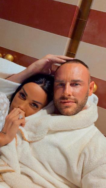 Katie Price and husband Andrew Lee Andrews in white bathrobes.