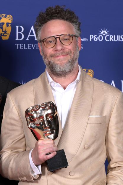 Seth Rogen holding the BAFTA International Award for The Studio.