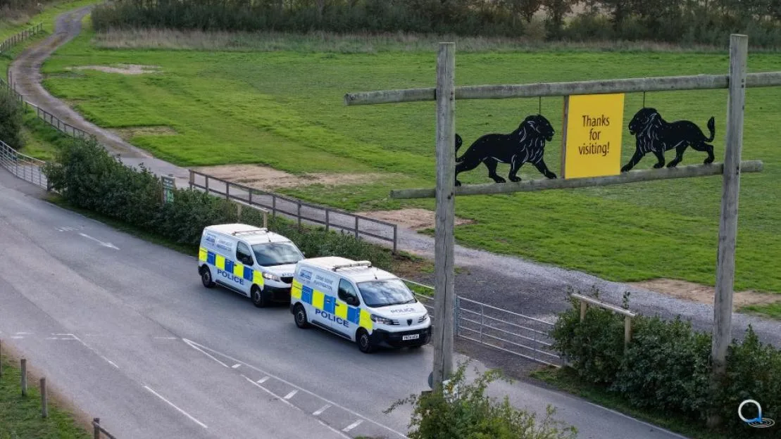 Two police vans parked outside the entrance of Yorkshire Wildlife Park.