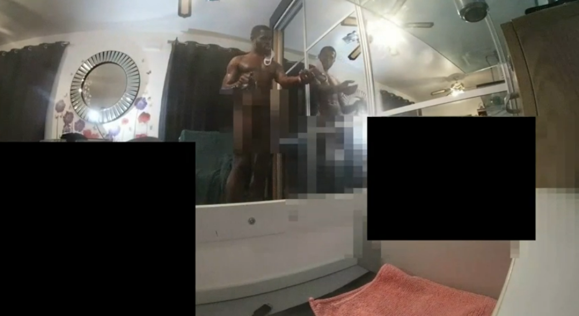 Screenshot of a nude man in a bathroom.