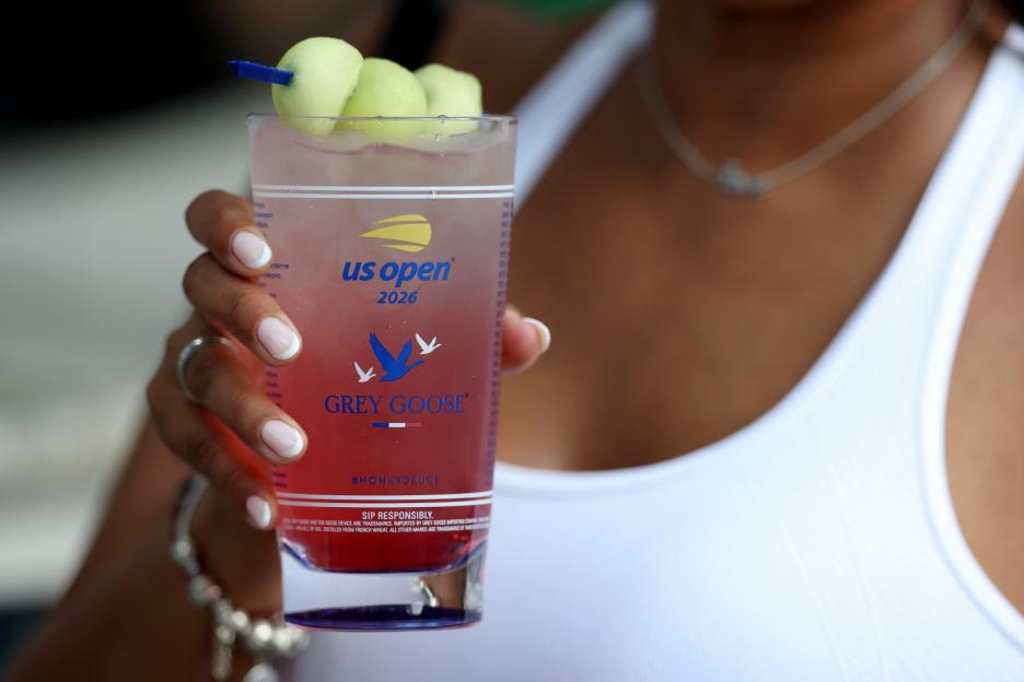 A hand holding a Grey Goose Honey Deuce cocktail at the 2026 US Open.