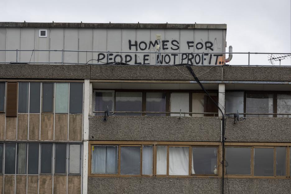 Graffiti on the Aylesbury Estate in Walworth, South London, reads "HOMES FOR PEOPLE NOT PROFIT."