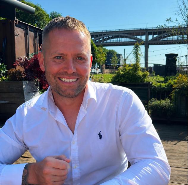 Smiling man in white shirt, PC Matthew Blades.