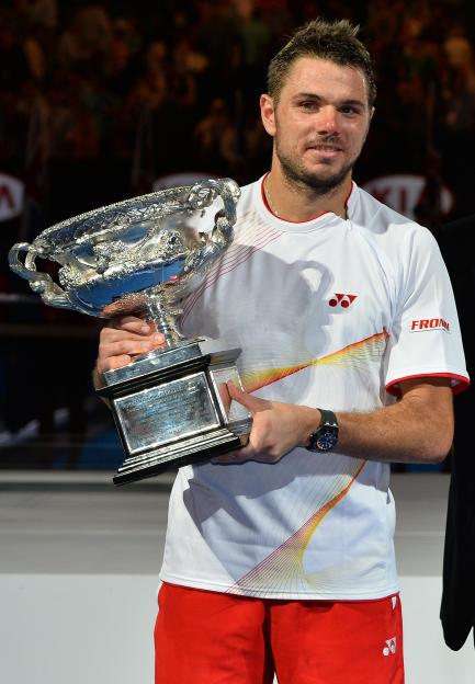 Stanislas Wawrinka holding the Australian Open trophy.