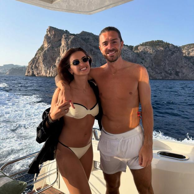 Sasha Attwood and Jack Grealish on a boat at sea.