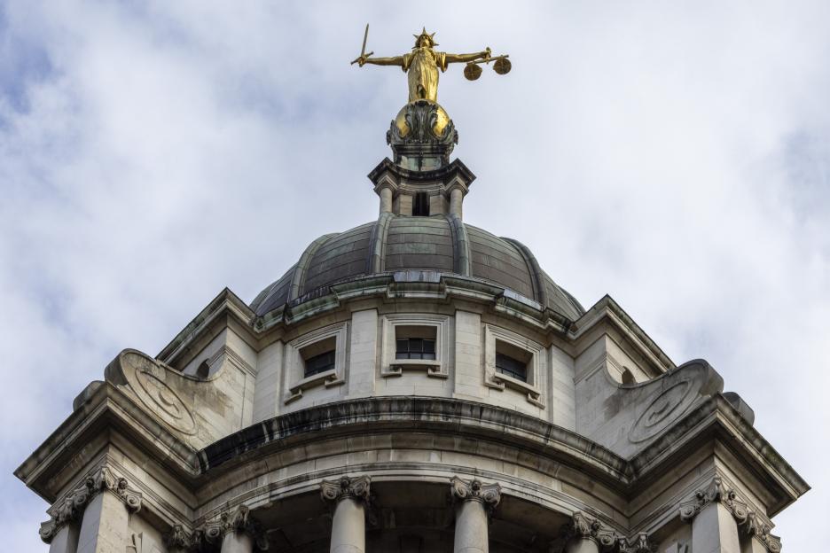 A gold statue of Lady Justice atop the Central Criminal Court building, also known as the Old Bailey, in London.