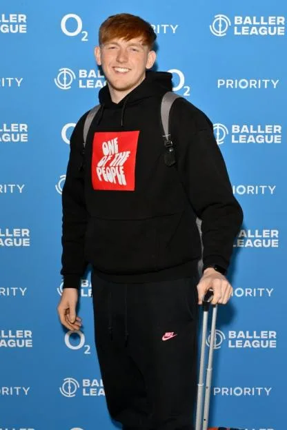 Angry Ginge at the "Baller League x Match Day 11" photocall, wearing a black hoodie with a red square graphic.
