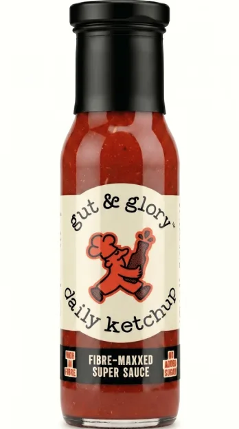 A bottle of Gut and Glory daily ketchup with a label indicating it is "fibre-maxxxed super sauce."