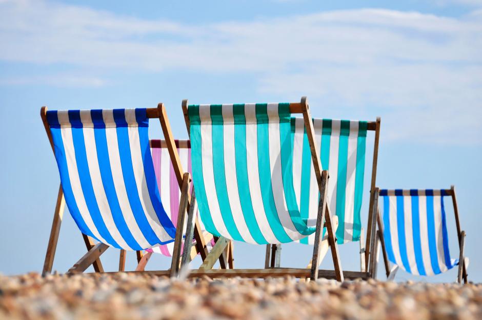 Striped deck chairs on Brighton beach.