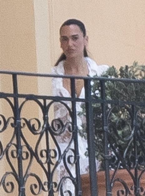 Dua Lipa on a balcony.
