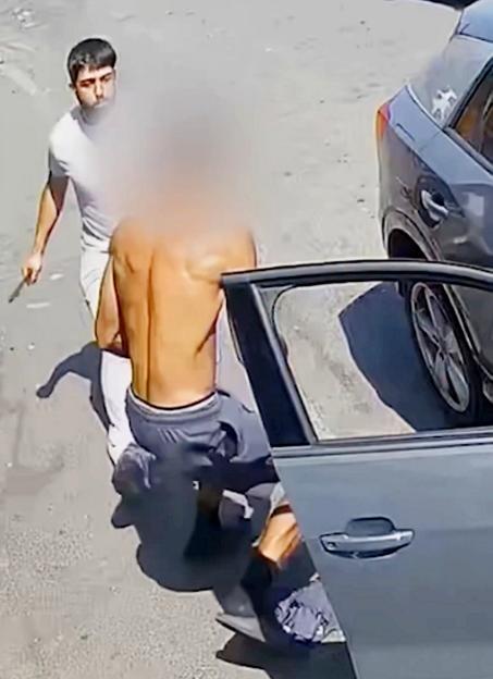 Moment thug stabs man twice with zombie knife after row erupts in street