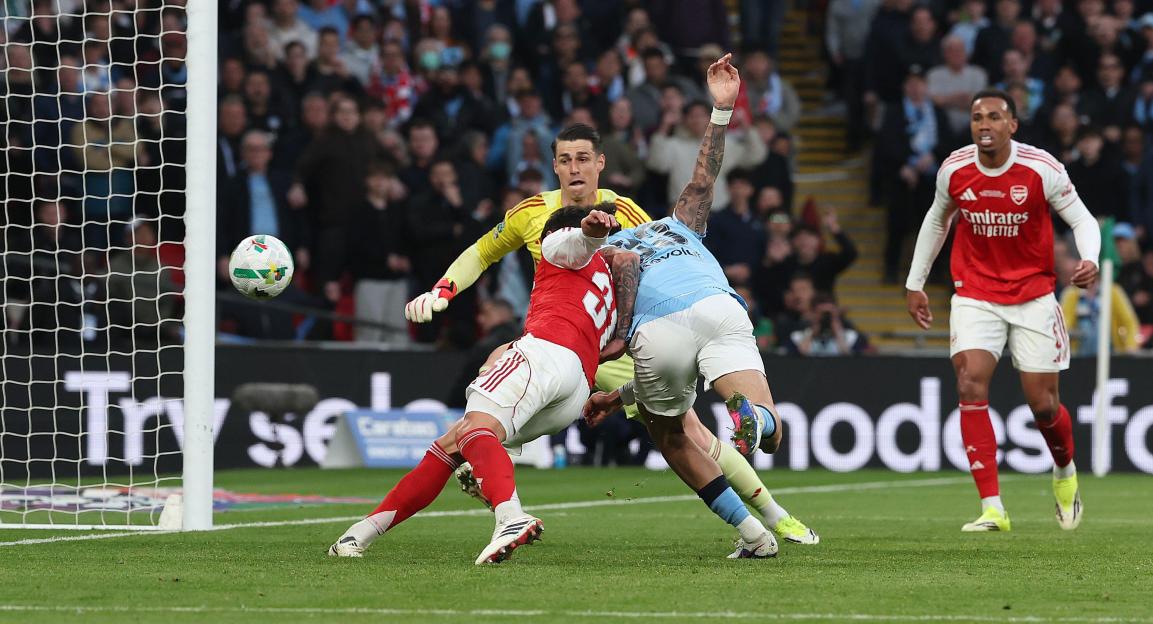 London, UK. 22nd Mar, 2026. Arsenal's keeper Kepa Arrizabalaga looks on as Manchester City's Nico O'Reilly heads in his first goal during the Carabao Cup Final match at Wembley Stadium in London. Credit: Telephoto Images/Alamy Live News
