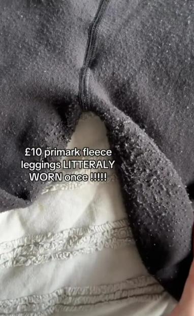 Close-up of pilled black fleece leggings with a caption describing them as "£10 Primark fleece leggings literally worn once."