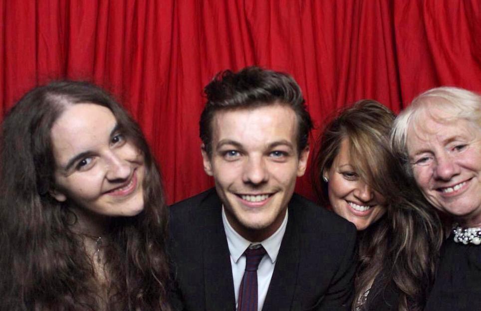 Megan Bhari, Louis Tomlinson, his mother Johanna, and Megan's mother Jean posing at the Cinderella Ball.