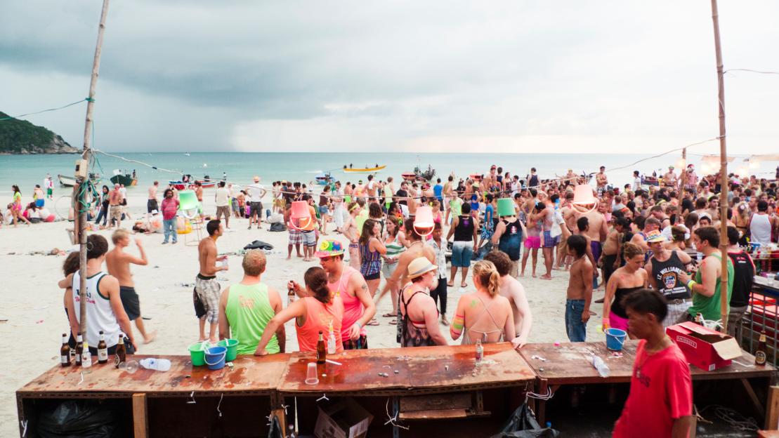 Full moon party on a beach in Koh Phangan, Thailand.